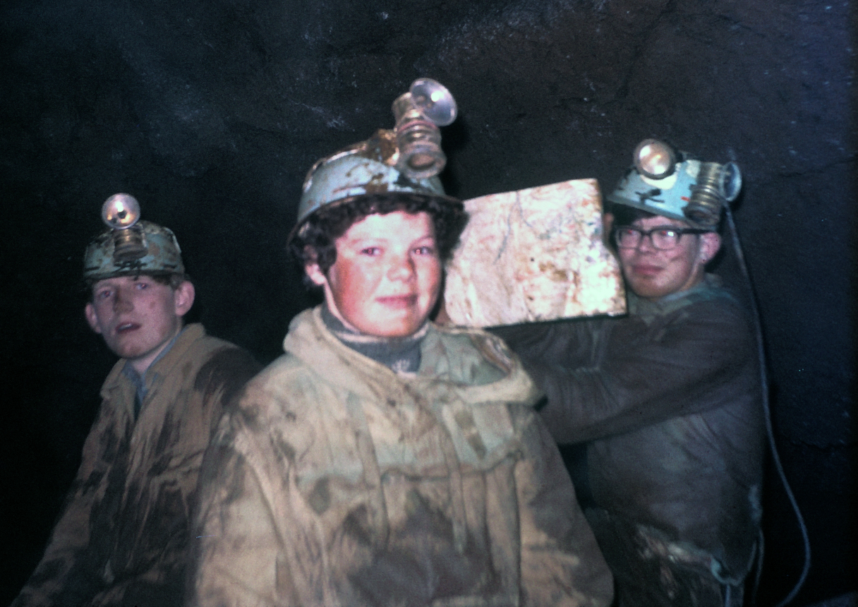 Michael Stower, Wendy Glanvill, Peter Glanvill in the Stream Chamber of Bakers Pit 11th March 1967. I am holding up a traced survey of the cave wrapped in polythene. I was wearing corduroy britches that kept falling down.