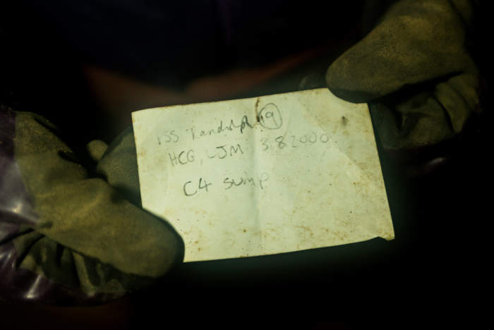 The survey note from Hilary and Lynn which Tony brought back from the far side of the C4 downstream sump (photo Paul Diffley)