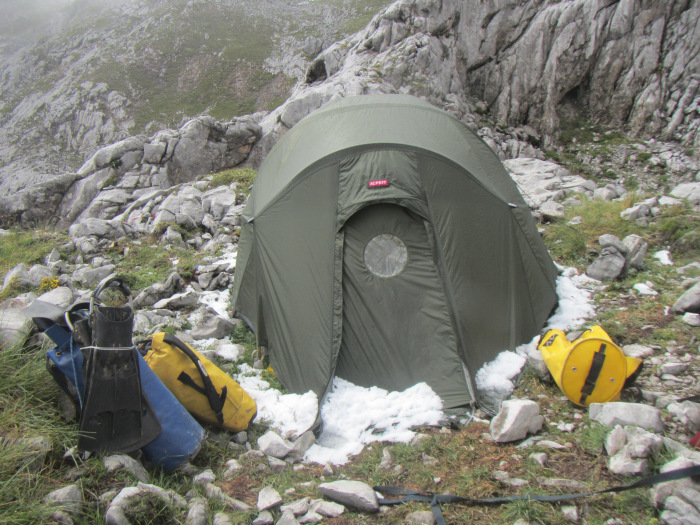 Snow and flippers: Alpkit tent by the entrance to C4 after the initial bad weather.